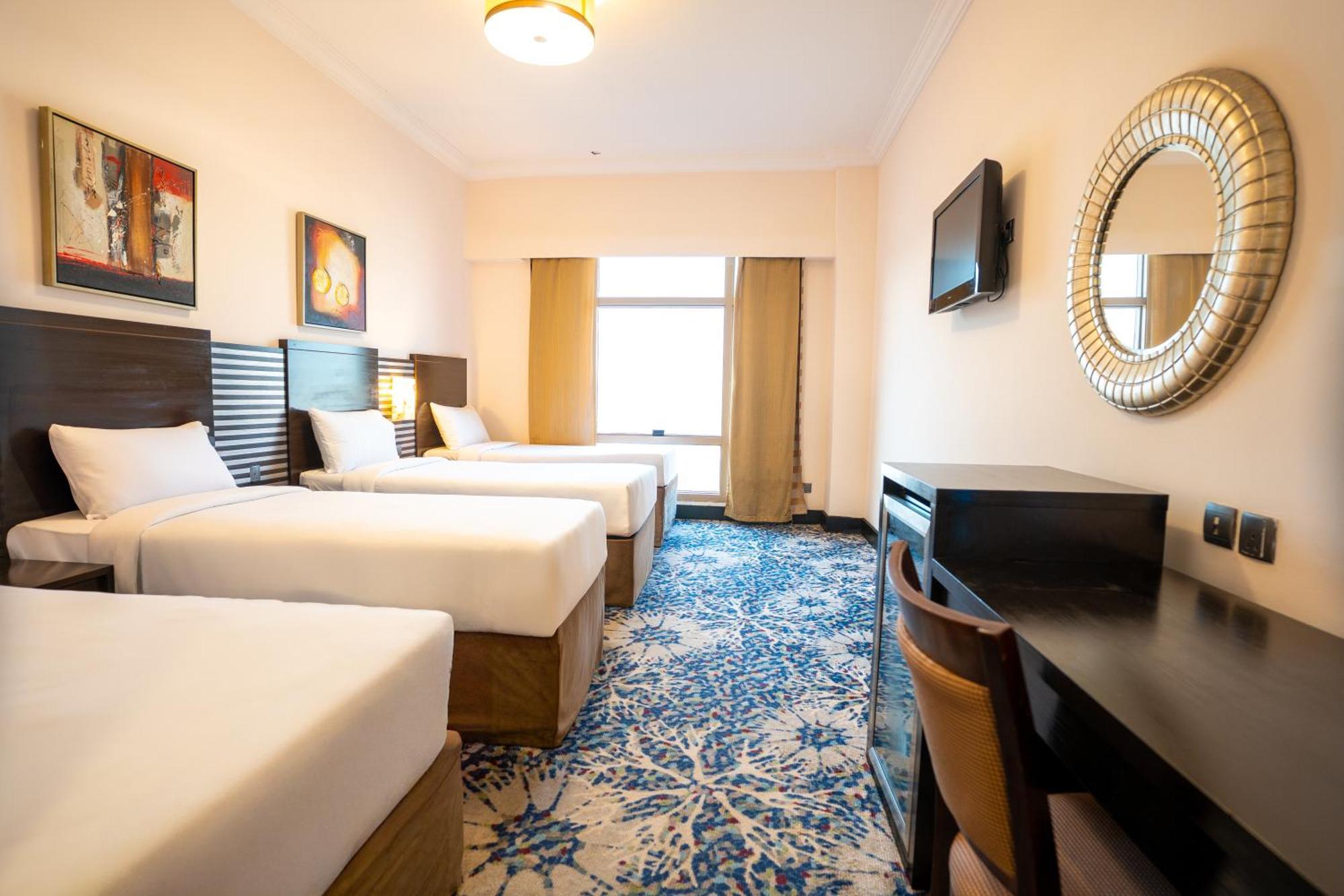 Deluxe Quad Room with Four Single Beds