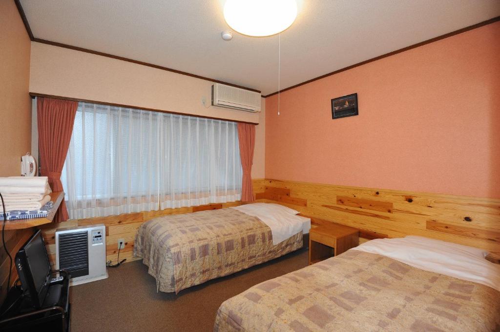 Zweibettzimmer mit eigenem Bad